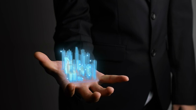 Biznesmen Trzyma Model Miasta 3d Przedstawiający Technologię Rozszerzonej Rzeczywistości