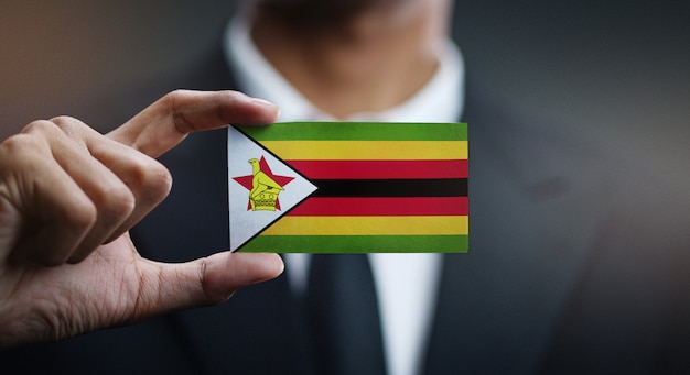 Biznesmena mienia karta Zimbabwe flaga