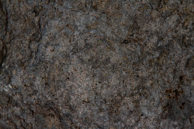 Bliska Czarna tekstura kamienia lawowego na tle kamiennej skóry