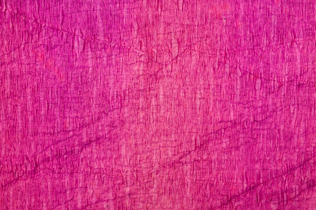 Bliska fioletowe stonowane tło tekstury papieru krepowego