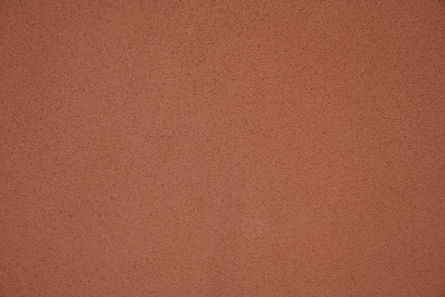 Brązowa betonowa powierzchnia zewnętrzna otynkowana ściana ciemnobeżowa tapeta tło grunge