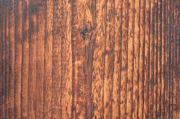 Brązowa tekstura drewna z naturalną ciemną deską jako tłem