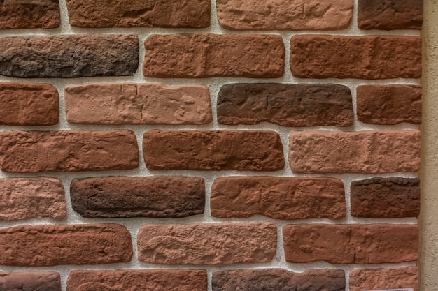 Brown cegieł ściany tekstury kamienny tło