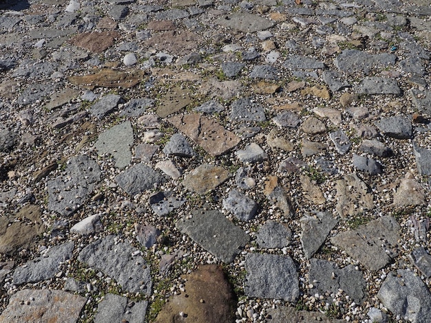 Brukowa droga Duże kamienie na drodze Tło z dużych kamieni Nawierzchnia drogi Tekstura kamieni