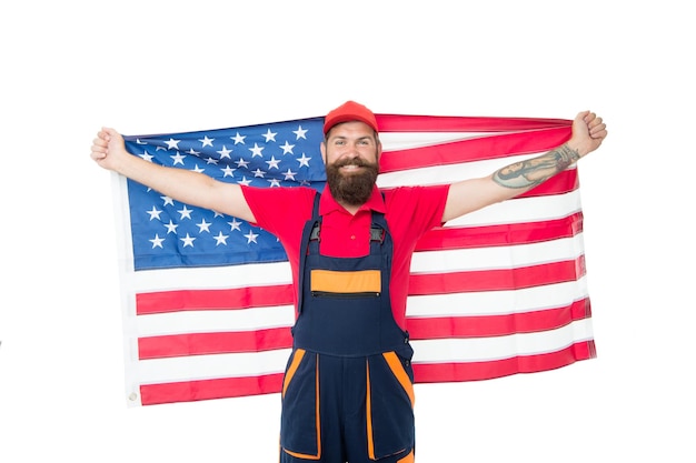 Zdjęcie bycie wdzięcznym za nasz naród szczęśliwy pracownik na białym tle twardy pracownik trzymający amerykańską flagę pracownik budowlany lub górnik świętujący dzień niepodległości człowiek pracownik lub rzemieślnik cieszący się wolnością