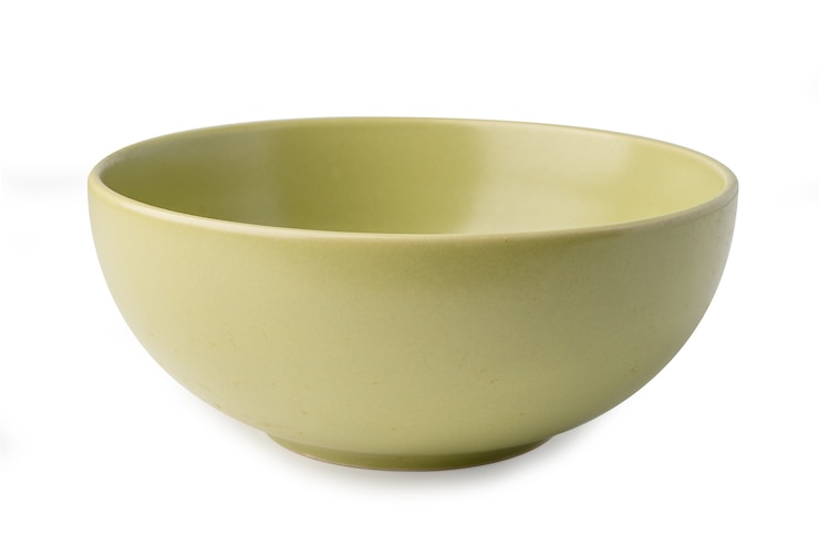 Zdjęcie ceramiczny zielony talerz lub miska.