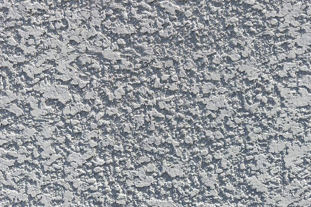 Zdjęcie cętkowany szorstki cement teksturowanej szarej ścianie