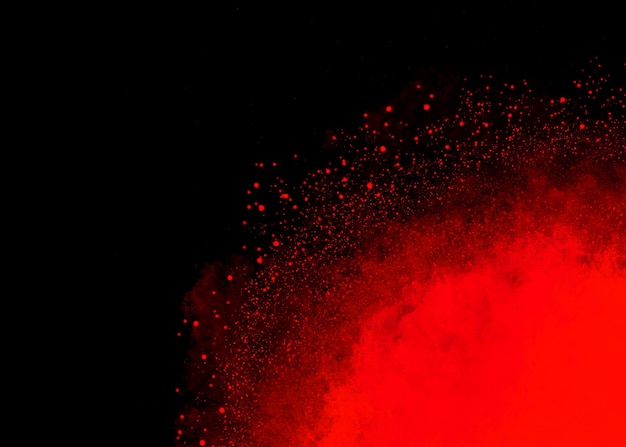 Chmura wybuchu cząstek pyłu w kolorze czerwonym na czarnym tle