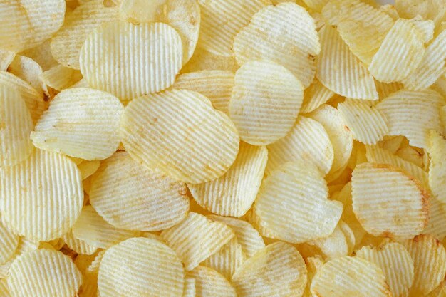 Zdjęcie chrupiące chipsy ziemniaczane przekąska tekstury tła