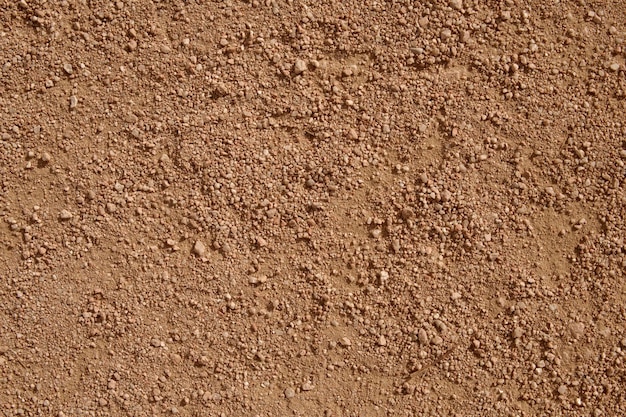 Ciemny gruby piasek tekstura tło