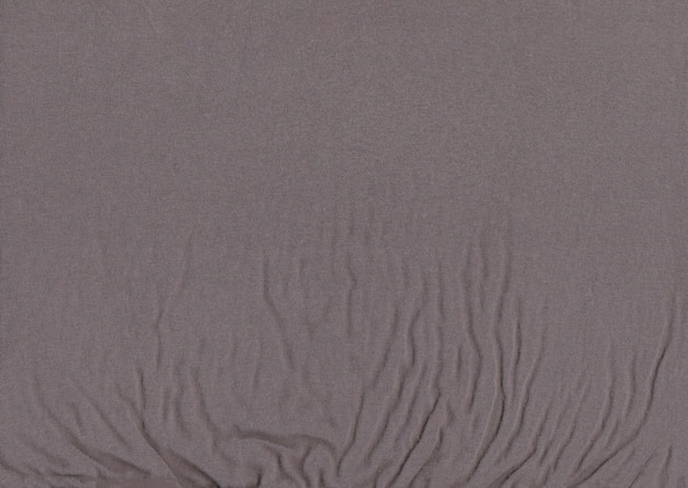 Zdjęcie ciepła przędza szare tło szara tkanina wrzosowa dzianinowa tkanina z teksturą tła