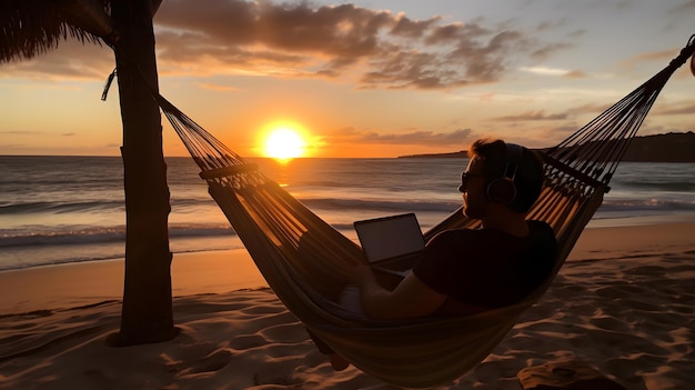 Cyfrowy koczownik pracujący siedząc w hamaku na tropikalnej plaży z pięknym zachodem słońca w tle Generative Ai