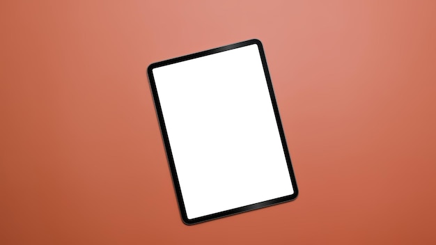 Cyfrowy tablet z pustym ekranem na pomarańczowym tle z miejscem na kopię Widok z góry Płaski lay