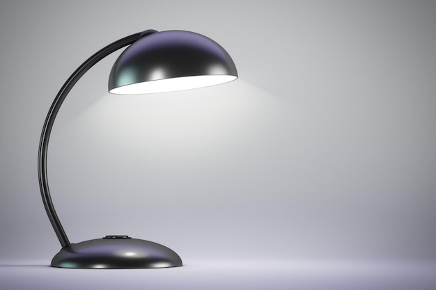 Czarna lampa stołowa jest na jasnym tle Kopiuj przestrzeń