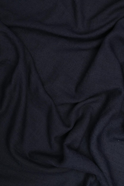 Czarna lub ciemno zabarwiona tekstura abstrakcyjnej tkaniny do tła