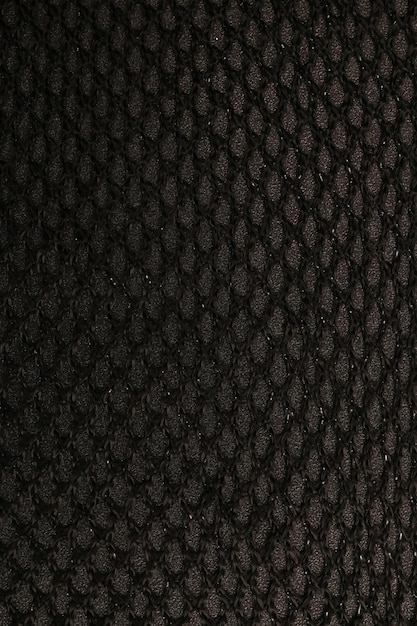 Zdjęcie czarna lub ciemno zabarwiona tekstura abstrakcyjnej tkaniny do tła
