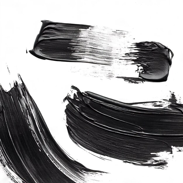 Zdjęcie czarne pociągi pędzla, farby olejowe na białym papierze, izolowane na białym tle, abstrakcyjne tło twórcze