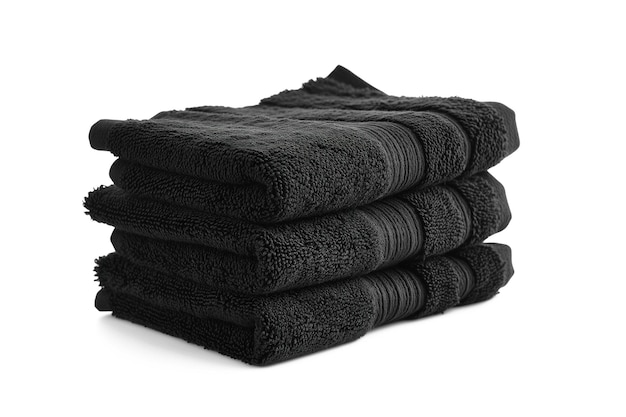 Czarne ręczniki ułożone na białych