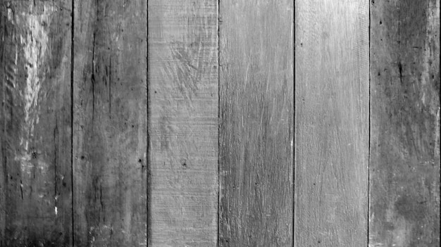 Zdjęcie czarno-biała stara brudna drewniana ściana na tle