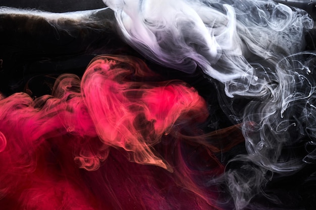 Czarno-czerwony atrament tło kolorowa mgła abstrakcyjna wirująca ocean farba akrylowa pigment podwodny biały dym