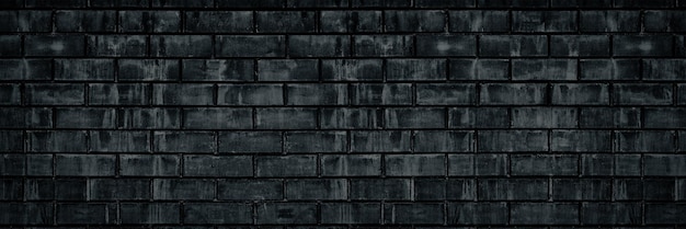 Czarny odrapany stary ceglany mur szeroka tekstura Ciemnoszary stary mur Grunge murowany duży tło