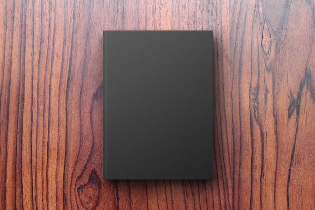 Zdjęcie czarny pamiętnik na drewnianym stole