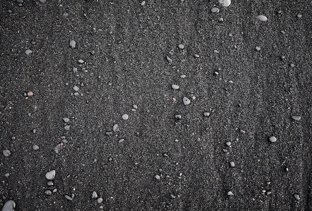 Czarny piasek jako tło na brzegu morza Islandii Kompozycja abstrakcyjna Obraz projektu