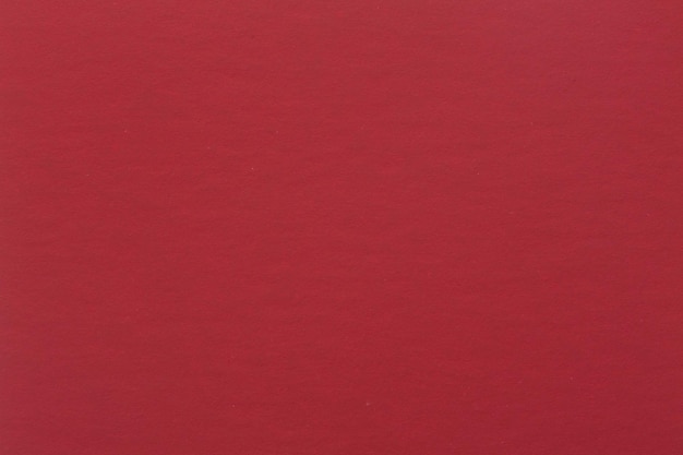 Czerwona czerpanego papieru tekstura tło na makro-