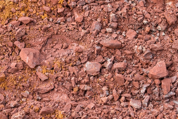 Czerwone podłoże teksturę tła Brud w przyrodzie Czerwony gleba twarda i zwarta na placu budowy