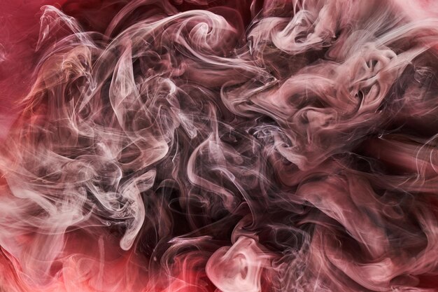 Czerwony czarny atrament abstrakcyjne tło Farba akrylowa tło dla kosmetyków perfum fajki Tajemnicze chmury dymu kolorowa mgła