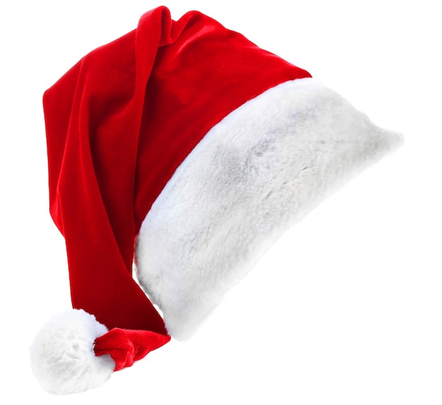 Czerwony kapelusz Świętego Mikołaja na białym tle na białej powierzchni, z bliska
