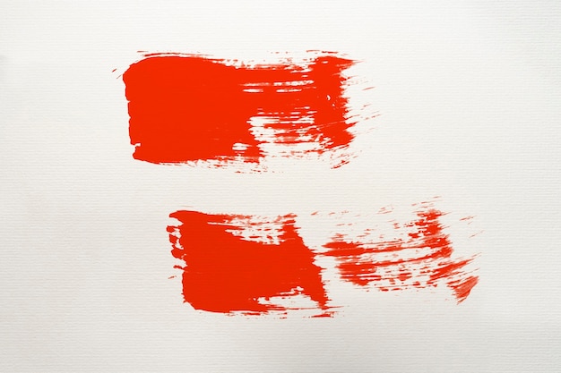 Zdjęcie czerwony pociągnięcie pędzla abstrakcyjna sztuka na tle sztuki papieru
