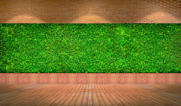Czerwony ściana z cegieł z świeżym zielonej trawy tłem