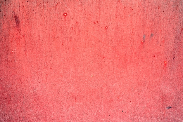 Czerwony wygryziony metal tekstury tło