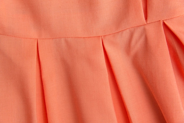 Część przepony lub sukienki jest bladoróżowy odcień przeznaczone do walki radioelektronicznej Odzież damska w fałdzie jasny kolor jako tło