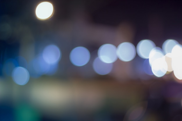 Defocused miasto noc filtrujący bokeh abstrakta tło.