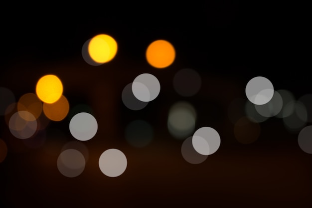 Defocused miasto noc filtrujący bokeh abstrakta tło