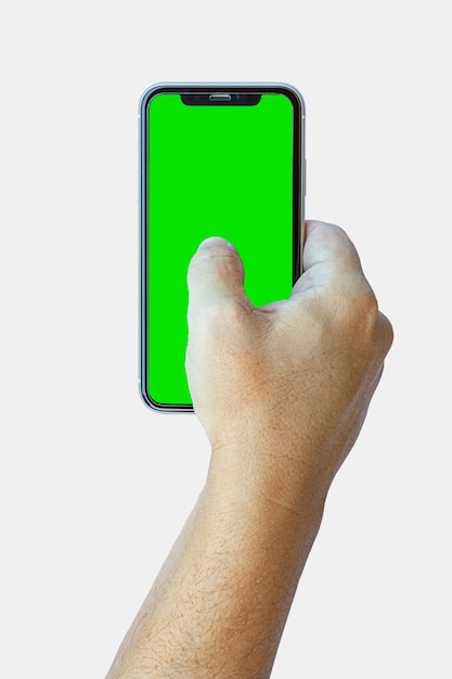 Dłoń trzymająca smartfon połączony z przodu z zielonym ekranem na białym tle. Selektywne skupienie.