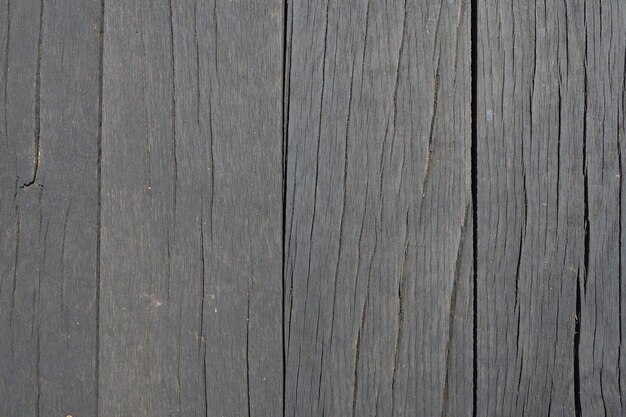 Drewniane deski przybite pionowo Struktura drewna Ciemny kolor drewna Tło z miejscem na kopię