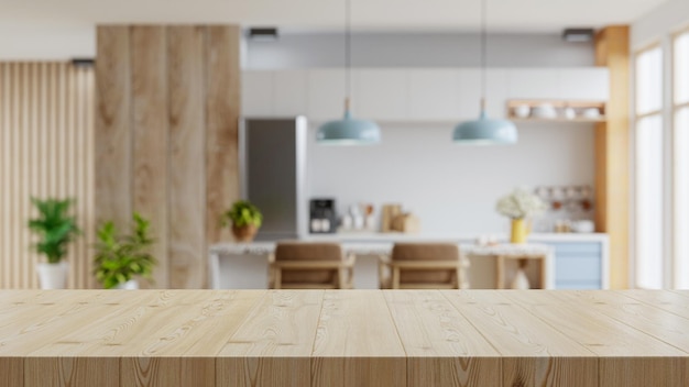 Drewniany blat na tle pokoju kuchennego rozmyciaNowoczesne współczesne wnętrze pokoju kuchennego