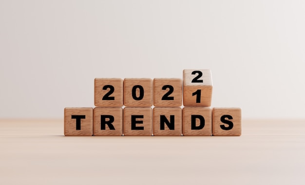 Drewniany blok kostki przerzucający trendy 2021 do 2022 dla planowania biznesowego i marketingu za pomocą renderowania 3d.