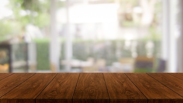 Drewniany stół w rozmytym nowoczesnej sali restauracyjnej lub kawiarni do makiety wyświetlania produktów.