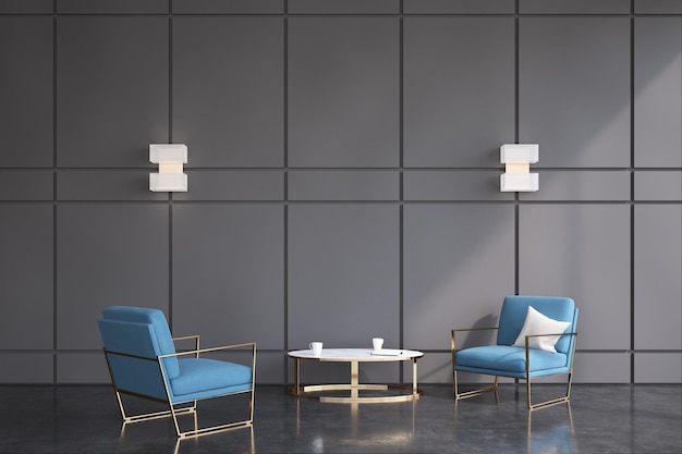 Dwa wygodne nowoczesne niebieskie fotele stoją naprzeciw siebie w pobliżu okrągłego stolika kawowego w biurowej poczekalni z ciemnoszarymi ścianami. Renderowanie 3D, makiety