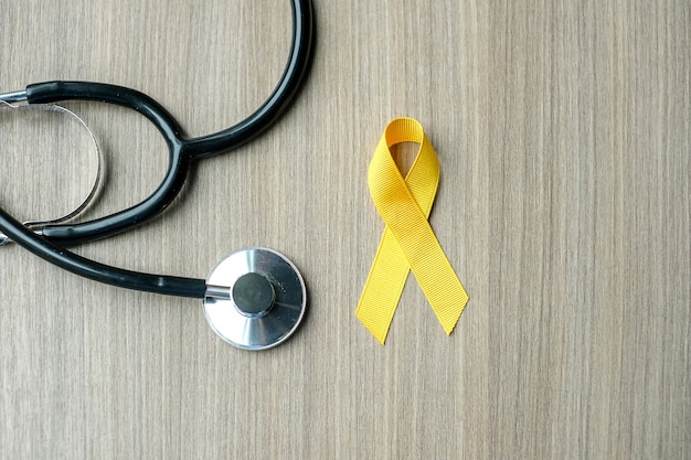 Dzieciństwo świadomości raka, żółta wstążka ze stetoskopem