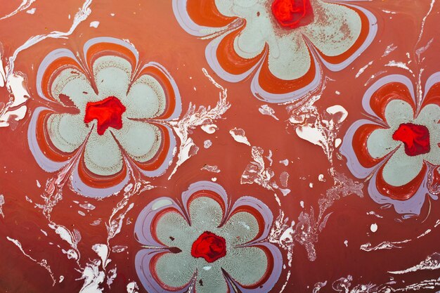 Zdjęcie ebru marmurkowatość art with flower pattern abstrakcyjna kolorowym tle