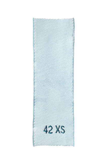 Etykieta odzieżowa w rozmiarze XS na białym tle