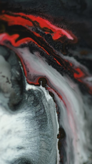Fala atramentu błyszcząca płynna farba przepływ wody czerwony czarny