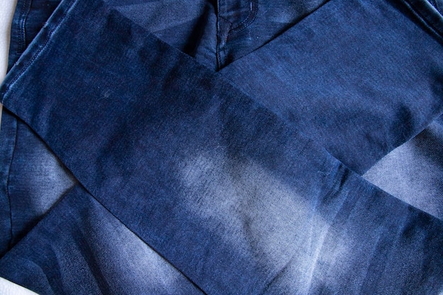 Fałdowe niebieskie dżinsy spodnie wzór tekstury tło