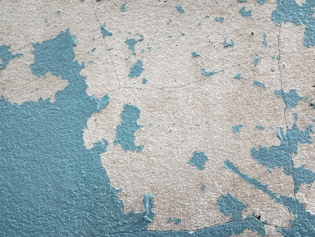 Farba zewnętrzna psuje się na starej podłodze cementowej Betonowa ściana jest brudna z łuszczącą się farbą do projektowania graficznego lub tapety Vintage tło w koncepcji retro