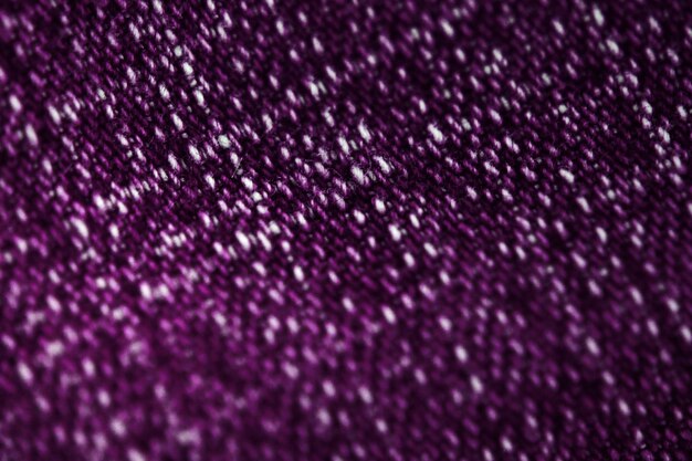 Fioletowa tkanina tekstylna tekstura bliska, skupienie tylko jednego punktu, miękkie tło blured